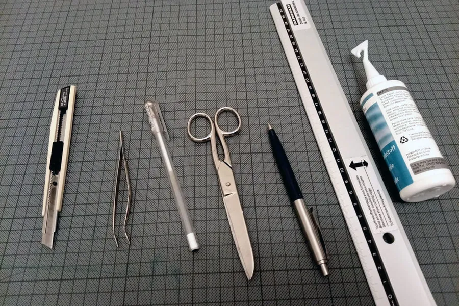 Scissors, glue, a ruler and other crafting tools on a table